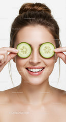 Young Woman with Cucumber Slices Over Eyes in Skincare and Wellness Concept