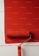 Red Paint Being Applied with Roller on White Wall for Home Renovation