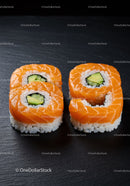 Fresh Salmon Sushi Rolls with Avocado on Black Plate