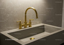 Gold Kitchen Faucet Over Concrete Sink in Modern Bathroom