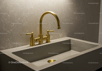 Gold Kitchen Faucet Over Concrete Sink in Modern Bathroom