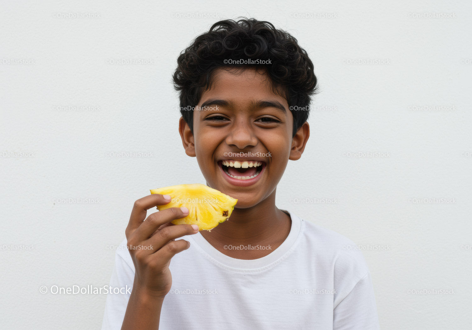 Joyful Boy Eating Pineapple Slice with Bright Smile