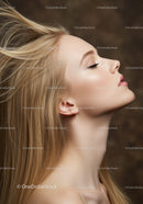Profile of a serene young woman with flowing blonde hair