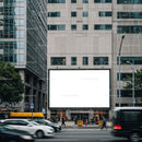 City street scene with blank billboard on office building