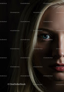 Close-up portrait of thoughtful young woman in shadow