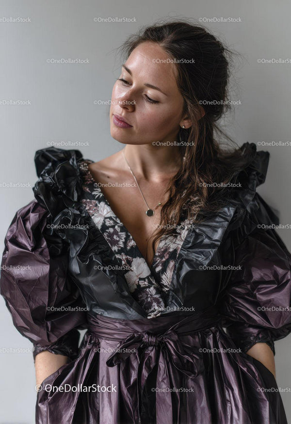 Elegant Woman in Black and Purple Ruffled Dress with Modern Style
