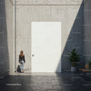 Woman in leather jacket facing large white door outdoors