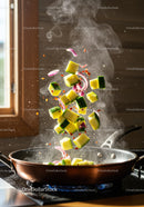 Fresh vegetables sizzling in a hot pan with steam