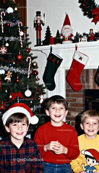 Three Happy Boys Celebrating Christmas at Home