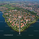 Aerial View of Lakeside Town with Red Roofs and Green Parks