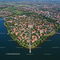 Aerial View of Lakeside Town with Red Roofs and Green Parks