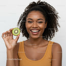 Smiling Woman with Kiwi Fruit on White Background