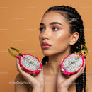 Young Woman with Braided Hair Holding Dragon Fruit Halves in Vibrant Setting