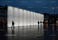Modern Building with Perforated White Facade and Night Street Scene