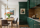 Elegant Green Kitchen with Wooden Dining Area and Vibrant Flowers