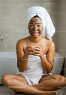 Young Woman with Face Mask Enjoying Skincare Routine at Home