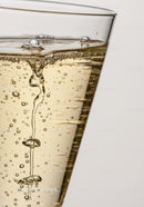 Close up of bubbles rising in a glass of sparkling drink