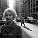 Elderly Woman in Busy City Street Surrounded by Vintage Cars