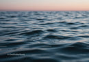 Calm Blue Ocean Waves Under Serene Sky Scene
