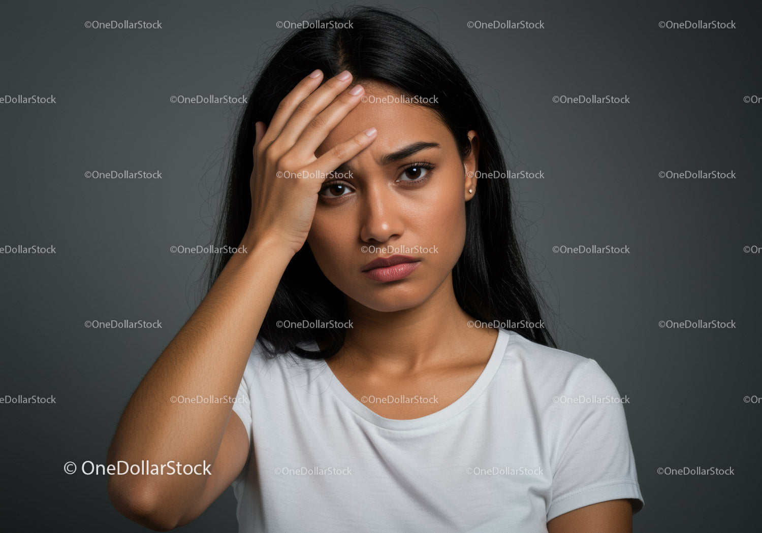 Young Woman Experiencing Stress and Headache in Gray Studio