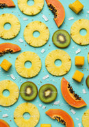 Assorted Tropical Fruit Slices Pattern on Blue Background