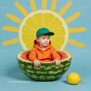 Toddler in watermelon boat with lemon sun background