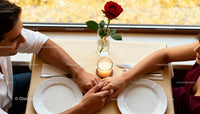 Couple Holding Hands During Romantic Dinner Date