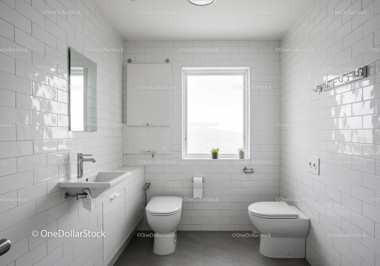 Clean White Bathroom with Ceramic Tiles and Natural Light