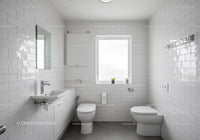 Clean White Bathroom with Ceramic Tiles and Natural Light