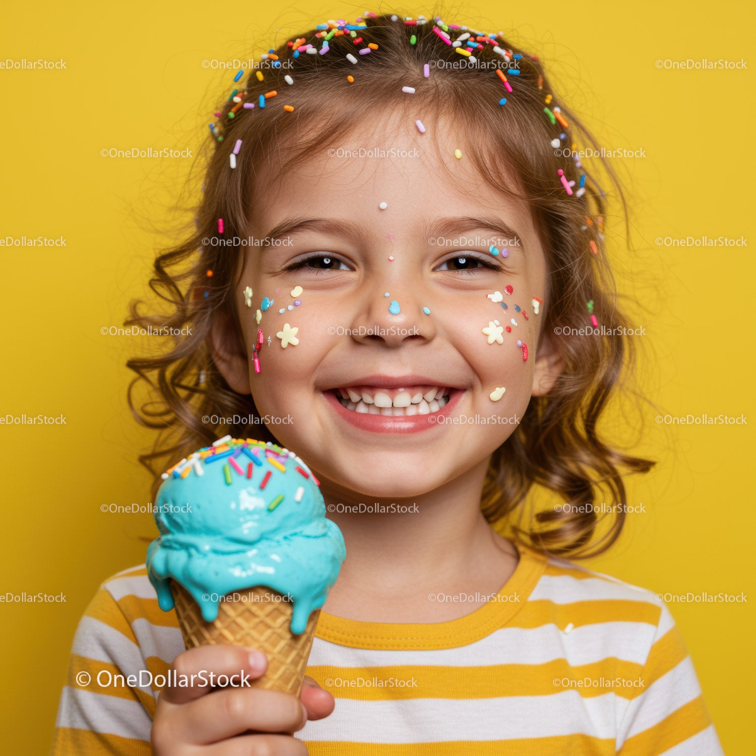 Smiling child with colorful sprinkles enjoying blue ice cream