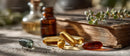 Herbal Supplements and Essential Oil Capsules on Rustic Wooden Table