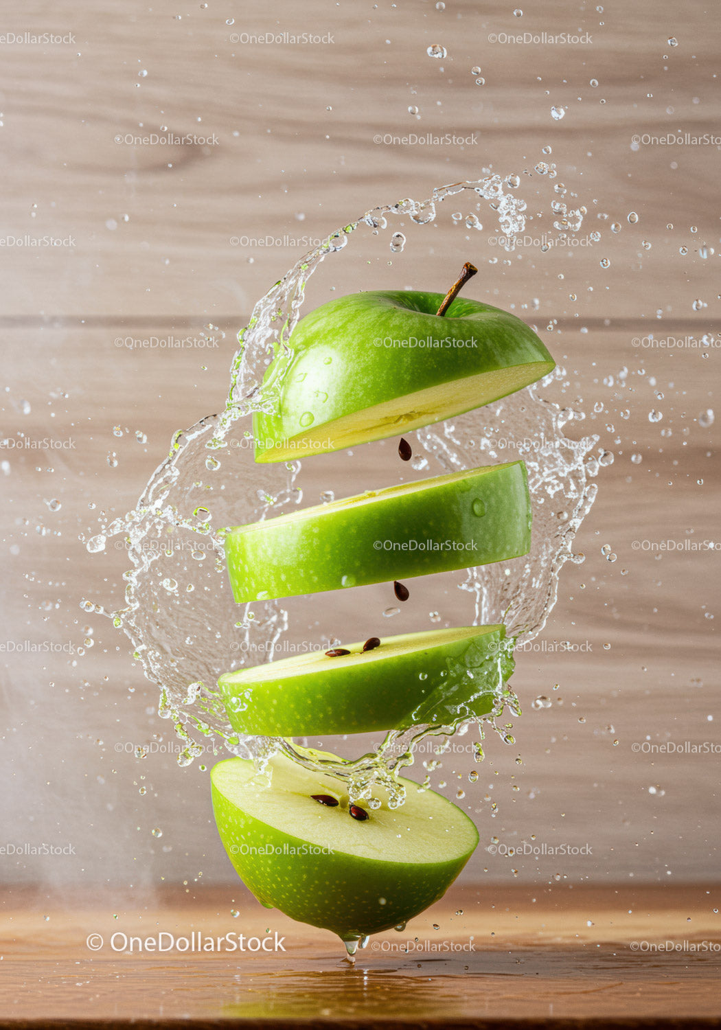 Fresh green apple slices with dynamic water splash