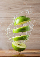 Fresh green apple slices with dynamic water splash