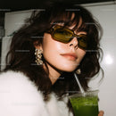 Glamorous Woman in Black Sunglasses Drinking Green Beverage