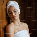 Relaxing Woman with Towel and Spa Experience in Cozy Wellness Environment