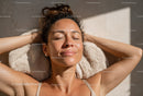 Relaxed Woman Sunbathing Outdoors in Beautiful Summer Setting