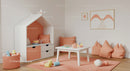 Stylish Children's Playroom with Soft Pastel Decor and Comfortable Seating