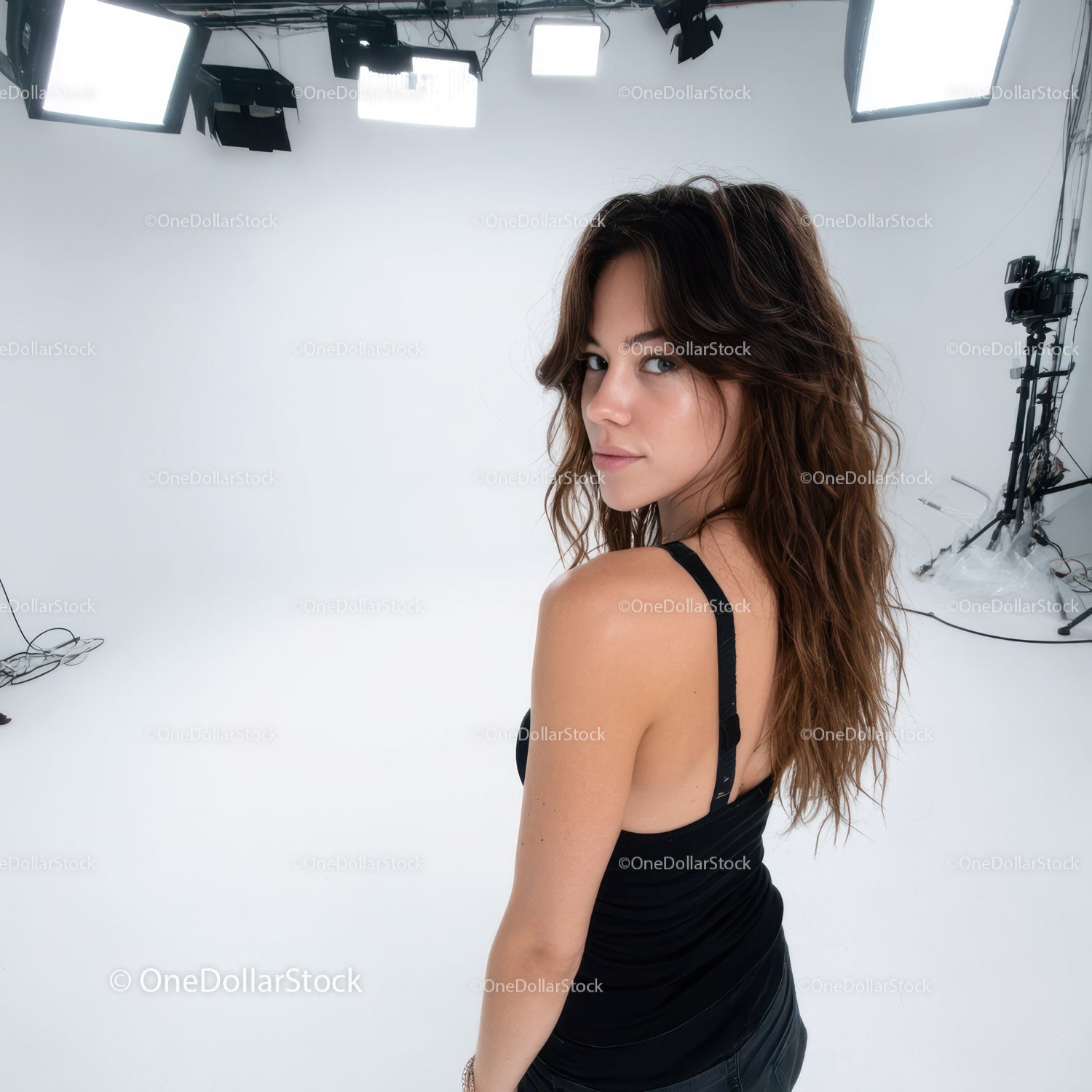 Elegant Woman in Black Dress Posing in Studio With Professional Lighting