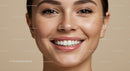 Close up of smiling woman with natural freckles and clear skin