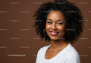 Portrait of a Smiling Black Woman with Curly Hair and Hoop Earrings