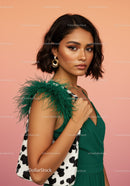 Fashionable Woman in Green Dress with Hoop Earrings on Pink Background