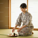 Young woman placing rice ball on wooden plate indoors
