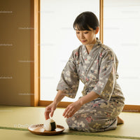 Young woman placing rice ball on wooden plate indoors