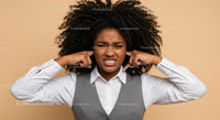 Frustrated Woman Covering Ears with Annoyed Expression