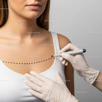 Woman Undergoing Clinical Breast Examination in a Healthcare Setting
