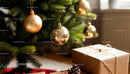 Golden ornaments and rustic gifts under Christmas tree