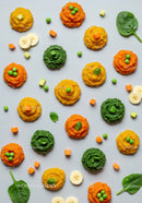 Colorful vegetable and fruit purees with fresh greens
