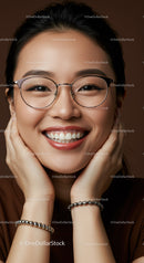 Smiling young woman with glasses and silver bracelets