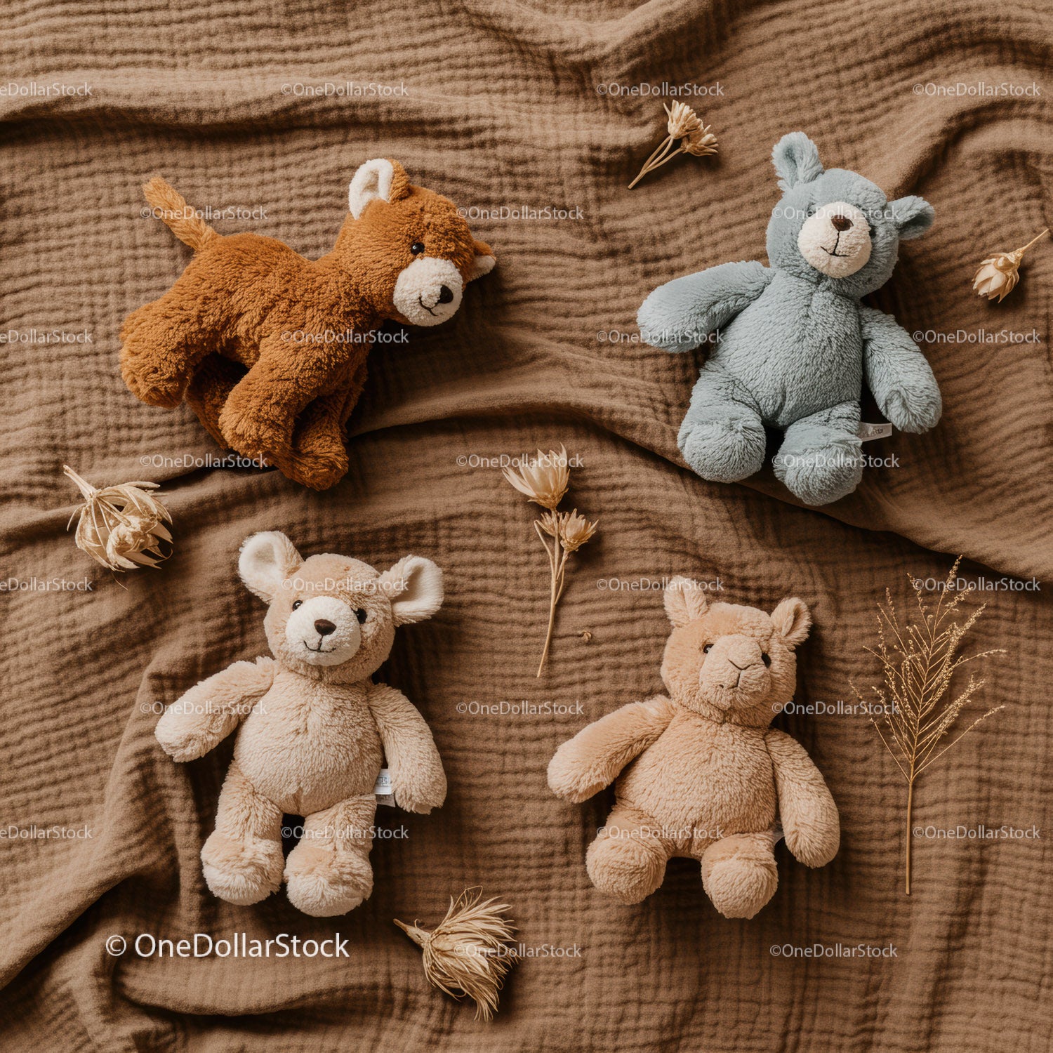 Four Plush Animal Toys on Textured Brown Fabric