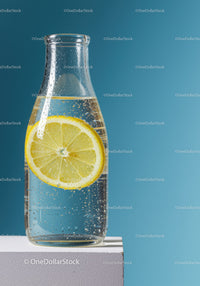 Refreshing Lemon Infused Water in Clear Glass Bottle